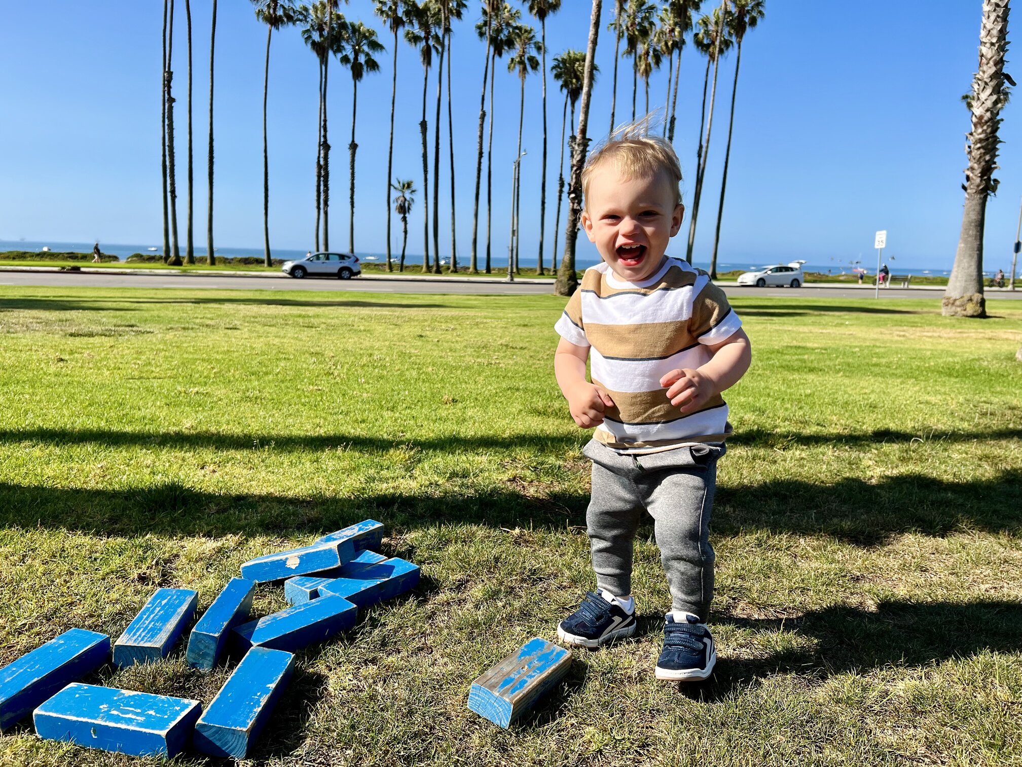 Best Things To Do in Santa Barbara with Kids Play lawn games at the Hilton Santa Barbara while looking at the ocean and palm trees. Photo Courtesy of Gina Ragland